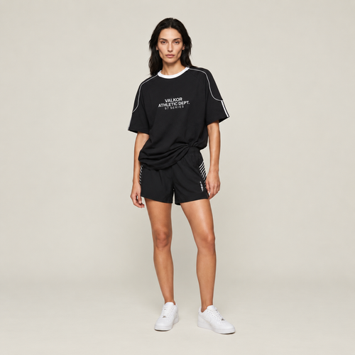 Model wearing Valkor 97 Color Block Tee in black with white details